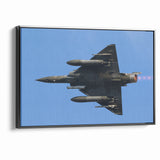 Modern Aviation Art: Fighter Jet in Flight Against Blue Sky Canvas Print