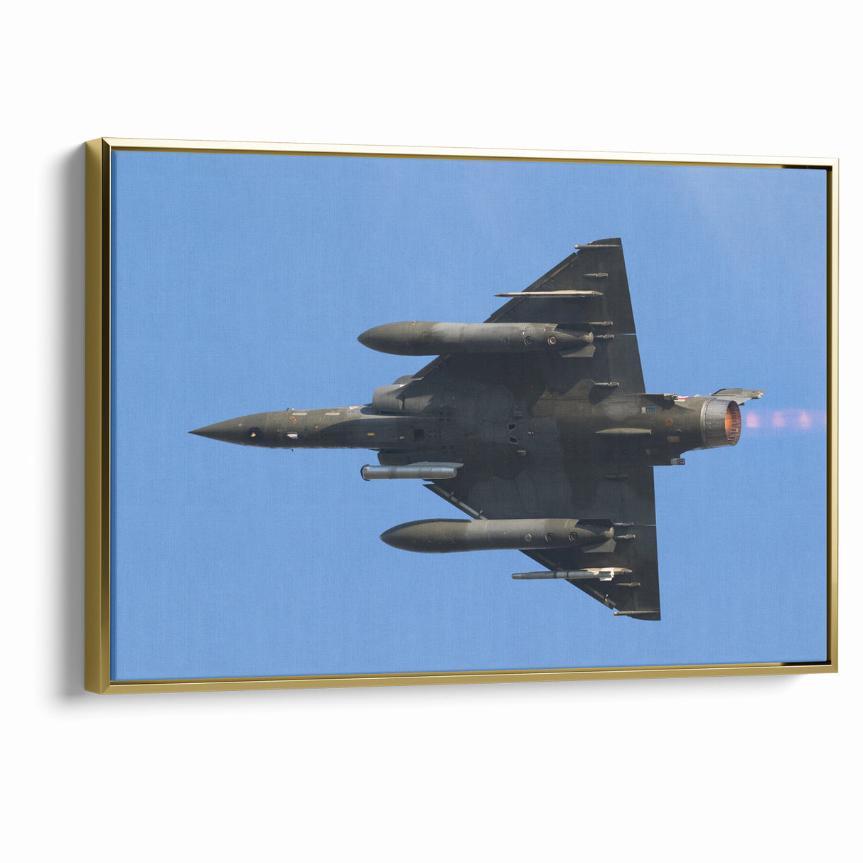 Modern Aviation Art: Fighter Jet in Flight Against Blue Sky Canvas Print