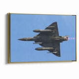 Modern Aviation Art: Fighter Jet in Flight Against Blue Sky Canvas Print
