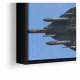 Modern Aviation Art: Fighter Jet in Flight Against Blue Sky Canvas Print