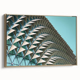 Framed canvas depicting a vintage landscape painting with vibrant, colorful art in a black frame.
