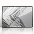 Large abstract wall art featuring swirls of black and white on acrylic, framed, ideal for modern living room decor.