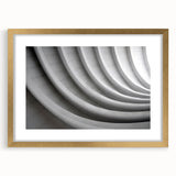 Textured art depicting abstract swirls in gold and beige tones on a framed canvas, suitable for bedroom art.