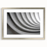 Abstract art print featuring swirling blue and gray tones on a framed canvas, suitable for dining room or bedroom decor.