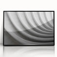 Large abstract wall art featuring swirling blue and gray tones on a framed acrylic, ideal for modern living room decor.