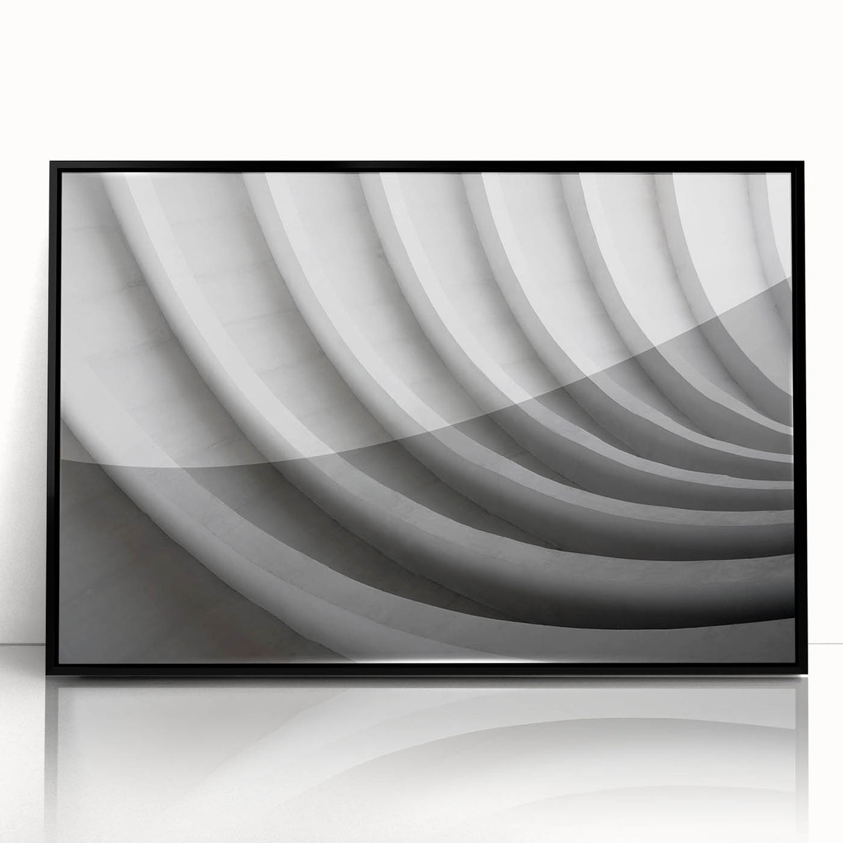 Large abstract wall art featuring swirling blue and gray tones on a framed acrylic, ideal for modern living room decor.
