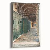 Framed canvas of a vintage landscape painting featuring colorful hills under a silver sky, ideal for living room decor.