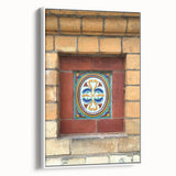 Framed vintage poster art featuring a colorful abstract design on a black background, ideal for living room decor.