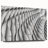 Large abstract wall art on acrylic glass featuring swirling blue and gray tones, suitable for bedroom or dining room decor.