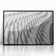 Large abstract wall art print featuring swirls in muted gray and blue tones on a framed acrylic.