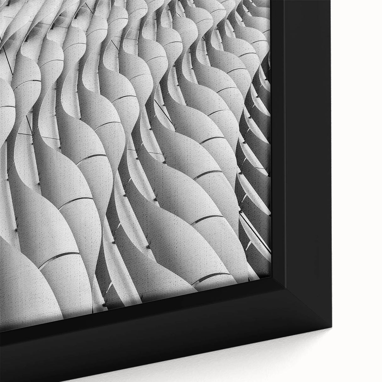 Close-up of textured black wall art with colorful abstract design on a framed canvas, suitable for large living room spaces.