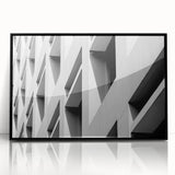 Large abstract wall art featuring swirling blue and gold patterns on a framed acrylic print.