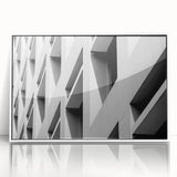 Large art print of a mid-century modernist abstract design in muted earth tones on framed acrylic.