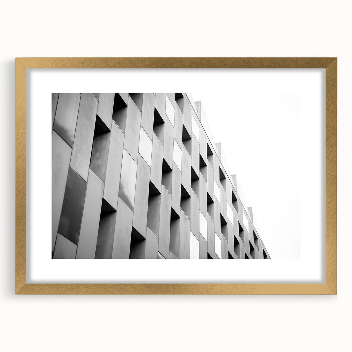 Textured abstract art print in neutral shades, displayed in a gold frame, ideal for bedroom wall decor.
