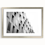 Abstract art print featuring swirling blue and gray tones on a framed canvas, ideal for modern dining room decor.