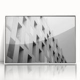 Large art print of a mid-century modernist abstract design in muted earth tones, framed in white acrylic.