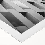 Art deco poster featuring geometric patterns and metallic gold and black tones on rolled canvas.