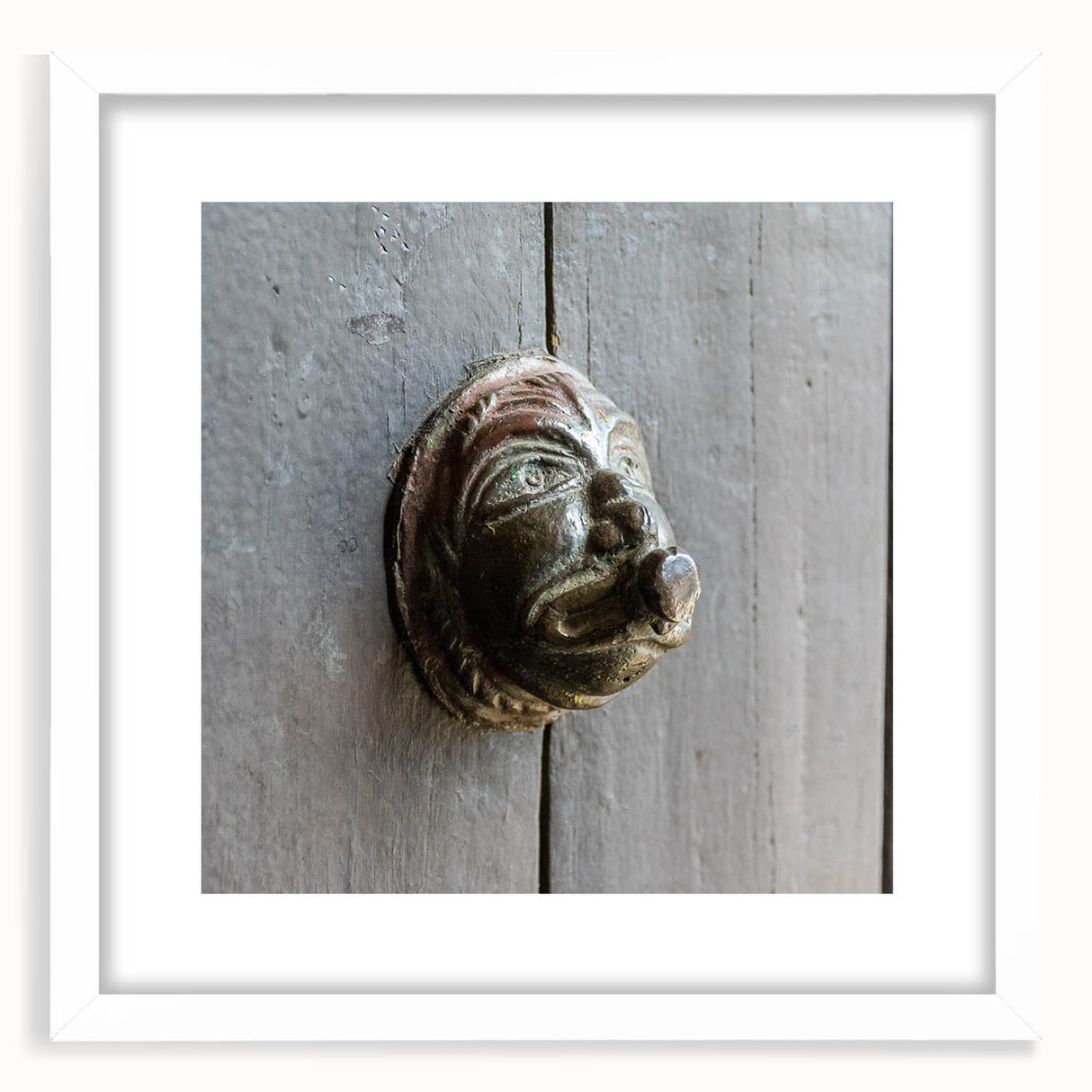 Abstract art print featuring swirling blue and green tones on a white framed canvas.