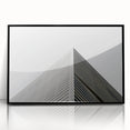 Large abstract wall art featuring swirling blue and gray tones on a framed acrylic, ideal for modern living room decor.