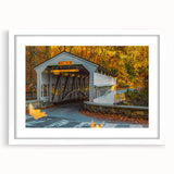 Abstract art print featuring swirling blue and gray tones on a white framed canvas, suitable for dining room decor.