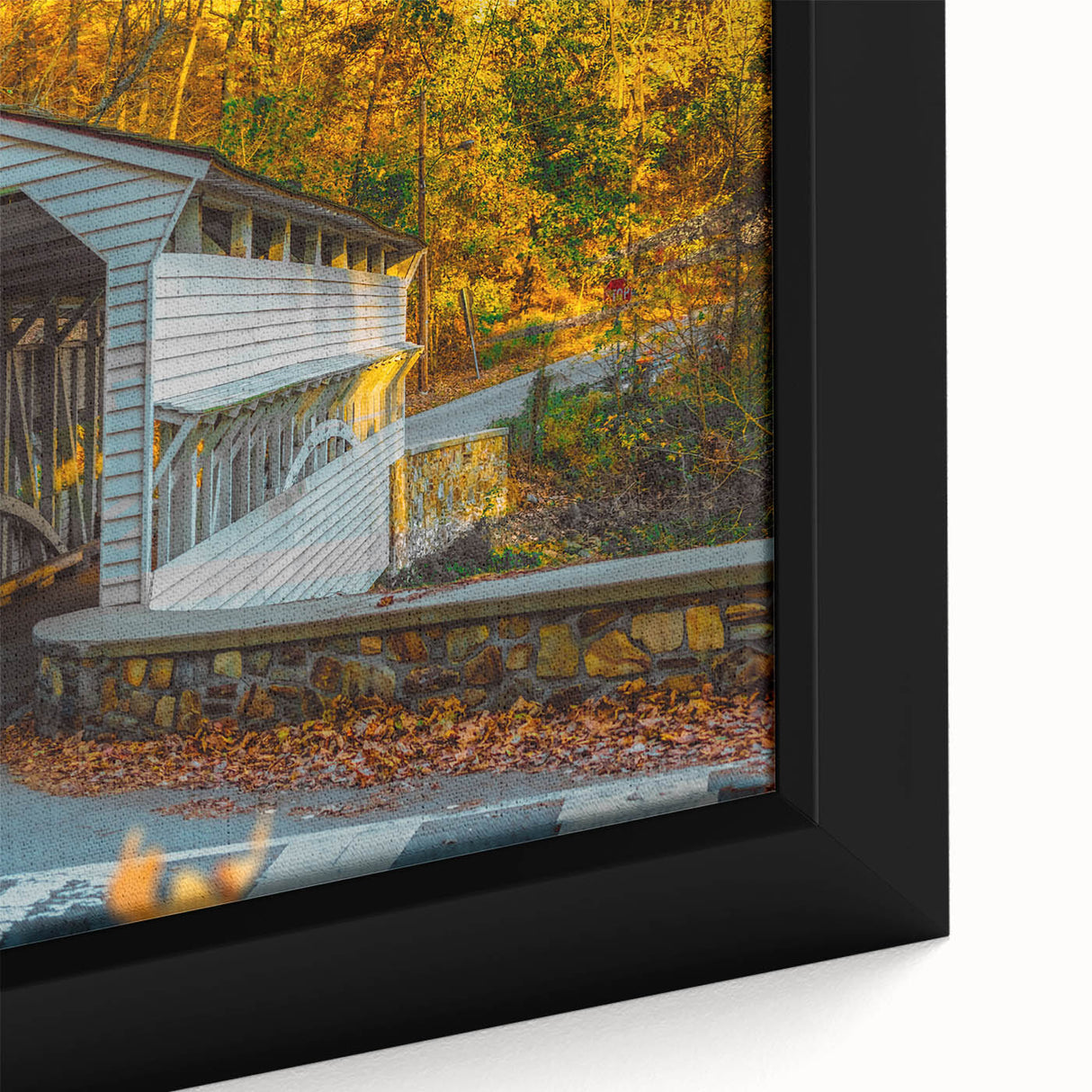 Close-up of textured black wall art with colorful accents on a framed canvas, ideal for living room decor.