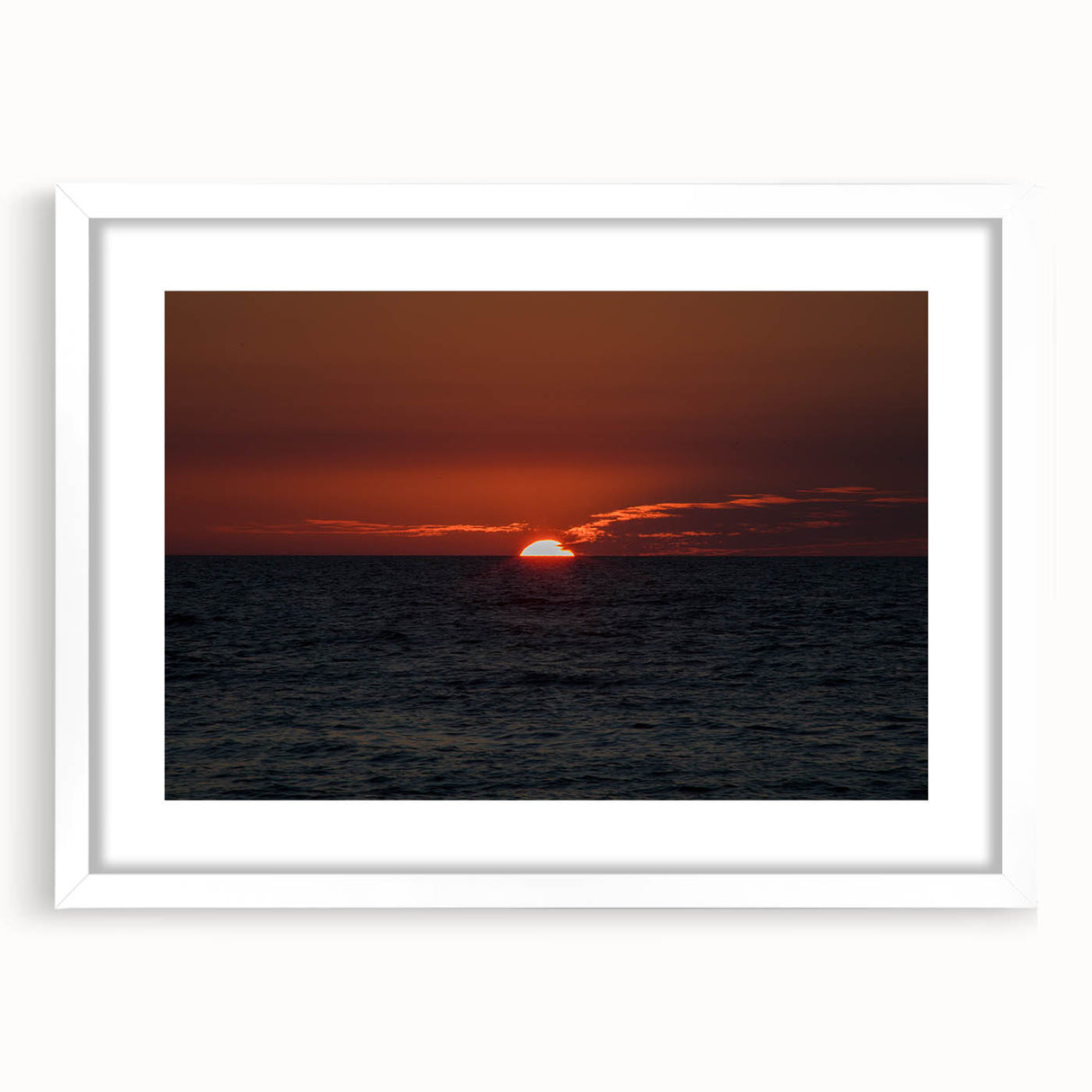 Abstract art print featuring swirling blue and gray patterns on a white framed canvas.