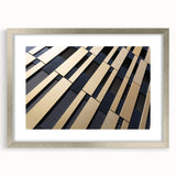 Abstract art print featuring swirls of blue and gray on a silver-framed canvas, suitable for bedroom or dining room decor.
