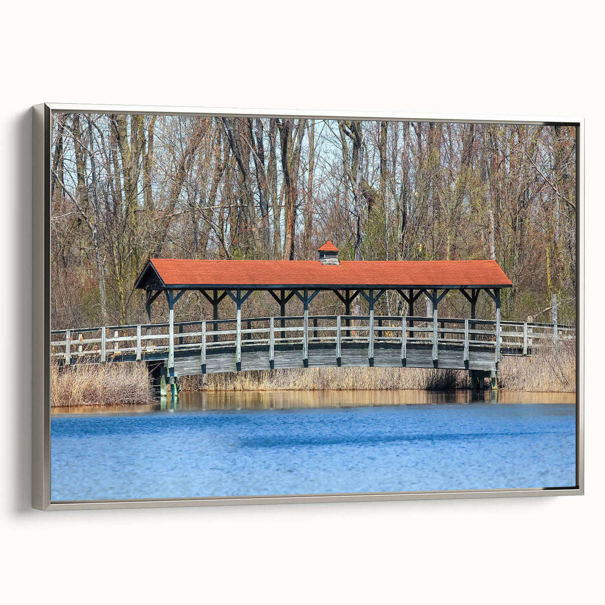 Framed canvas featuring a vintage landscape painting in colorful hues, ideal for enhancing a modern living room.