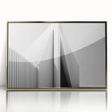 Mid-century modernist art deco poster featuring geometric shapes in gold and black, framed acrylic.