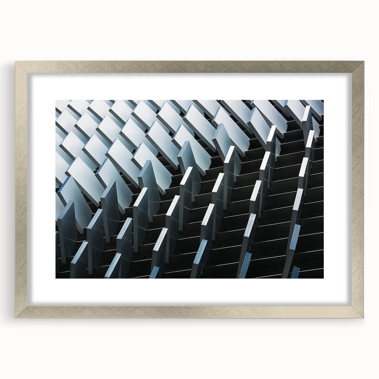 Abstract art print featuring swirling blue and silver tones on a framed canvas, suitable for bedroom or dining room decor.