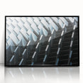 Large abstract wall art featuring swirling blue and gray tones on a framed acrylic print.