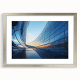 Abstract art print featuring swirling blue and silver patterns on a framed canvas, suitable for dining room or bedroom decor.