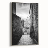 Framed canvas of a vintage landscape painting with vibrant colors, ideal for living room decor.