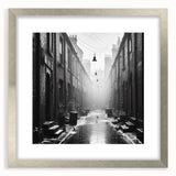 Textured abstract art print in shades of gray and white, displayed in a silver frame, suitable for bedroom decor.