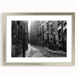 Abstract textured art print in silver frame, featuring dynamic swirls in muted gray tones, suitable for bedroom wall decor.