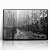 Large abstract wall art featuring swirling blue and white patterns on a black acrylic print.