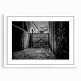 Abstract art print featuring swirling blue and gray tones on a white framed canvas.