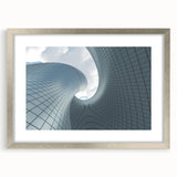 Abstract art print in silver frame featuring swirling blue and gray tones, suitable for bedroom or dining room decor.