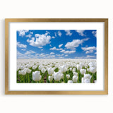 Vibrant bouquet of assorted flowers in various colors, including red roses and yellow daisies, arranged elegantly in a decorative vase on a wooden table. Perfect for home decor or gifting.