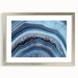 Textured art featuring abstract swirls in earthy green tones on a canvas, suitable for bedroom wall decor.
