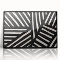 Framed abstract minimalist wall art design in black and white, showcasing geometric shapes and lines, perfect for modern home decor. This acrylic piece adds a stylish touch to any interior space, enhancing visual aesthetics.