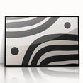 Framed minimalist wall art featuring an abstract black design, showcasing a sleek, modern aesthetic. Ideal for contemporary decor in living spaces or offices.