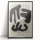 Framed abstract minimalist wall art featuring a sleek black design, showcasing geometric shapes and clean lines, perfect for modern home decor.