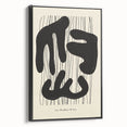 Framed canvas wall art showcasing an abstract minimalist design with a black color palette, viewed from the side, ideal for modern home decor or office spaces.