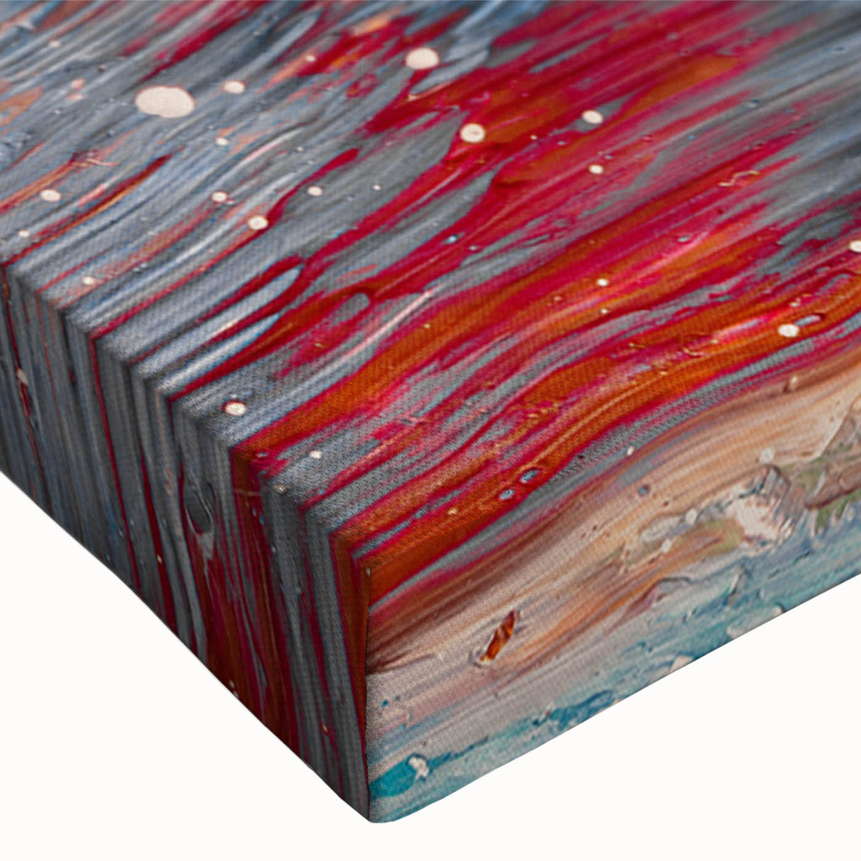 Colorful abstract splatter design on stretched canvas, showcasing vibrant hues of blue, orange, and yellow, perfect for modern home decor.