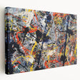 Vibrant abstract splatter design in bold colors on a stretched canvas wall art piece, showcasing dynamic patterns for modern decor.