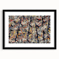 Framed abstract wall art with vibrant splatter designs in various colors, set in a sleek black frame, enhancing modern decor aesthetics.