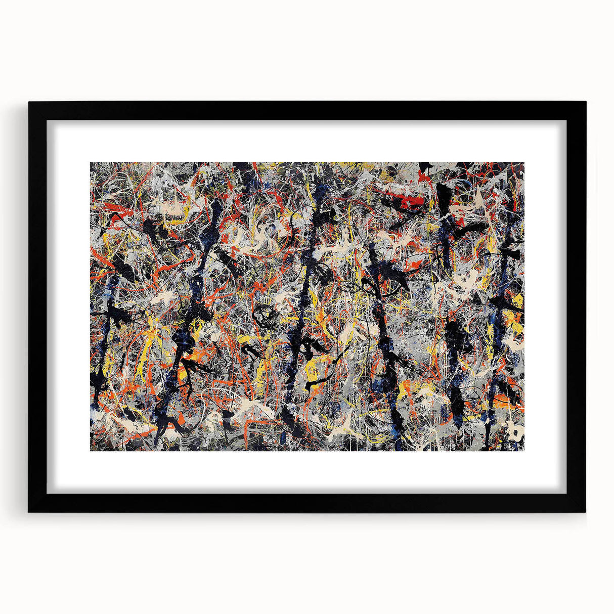 Framed abstract wall art with vibrant splatter designs in various colors, set in a sleek black frame, enhancing modern decor aesthetics.