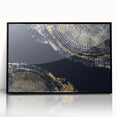 Framed wall art featuring an abstract design of colorful strokes and lines on a black background, adding a modern touch to any decor.