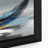 Close-up of a framed abstract canvas wall art featuring vibrant strokes and lines in shades of blue, yellow, and pink, perfect for modern decor.